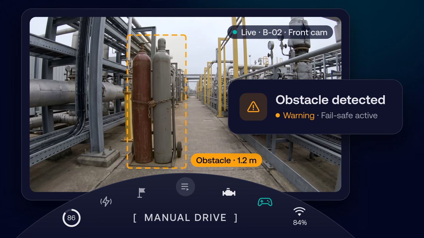 Korial manual drive view with an obstacle detected ahead, a fail-safe warning and the drive console showing device status and speed