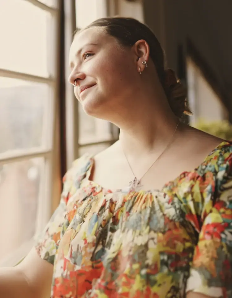 A women looking out through a window