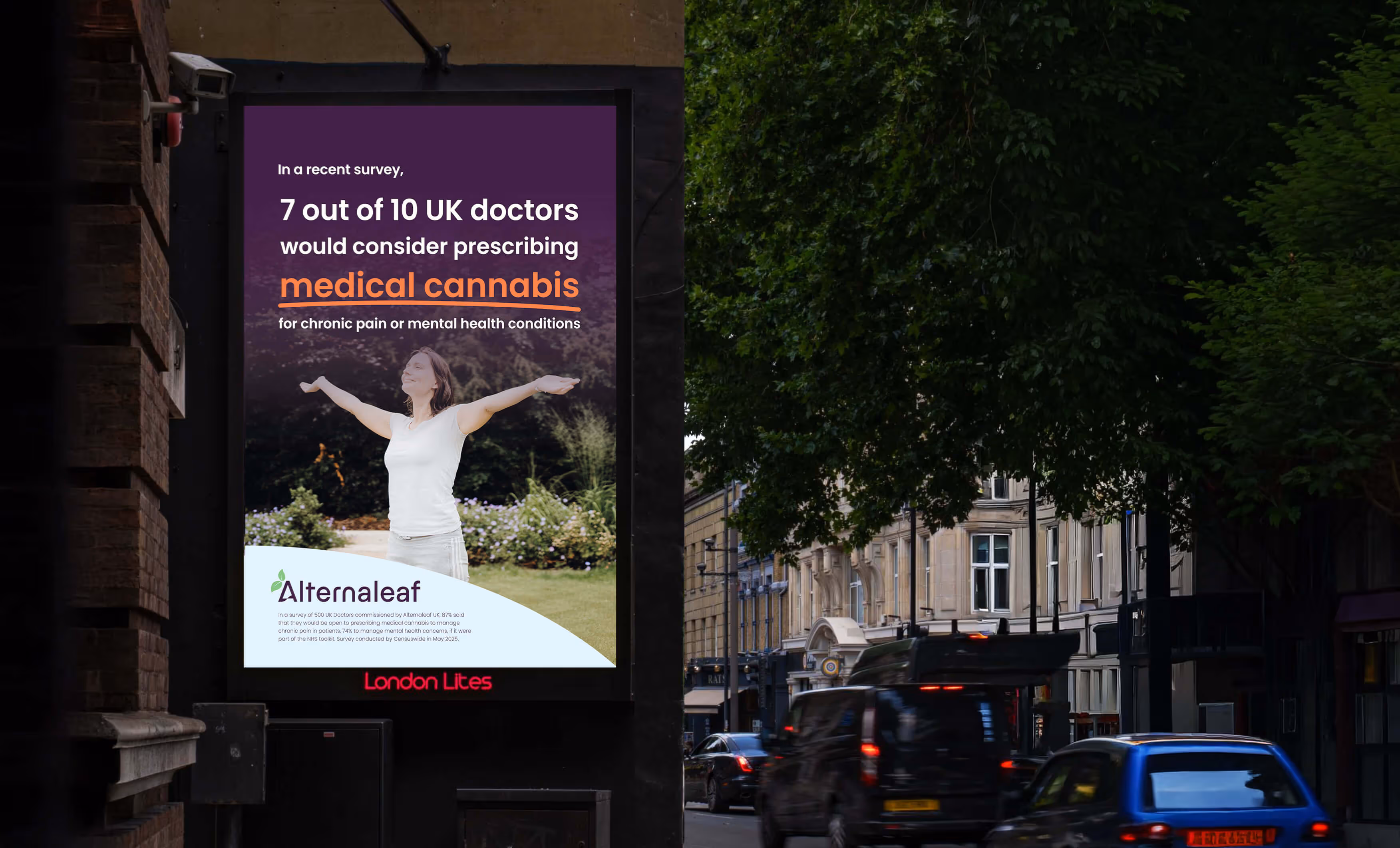 A brightly lit billboard displays an ad for "Alternaleaf," stating "7 out of 10 UK doctors would consider prescribing plant medicine for chronic pain or mental health conditions." A woman with outstretched arms is pictured surrounded by plants. The billboard is on a street with moving cars and buildings visible in the background.