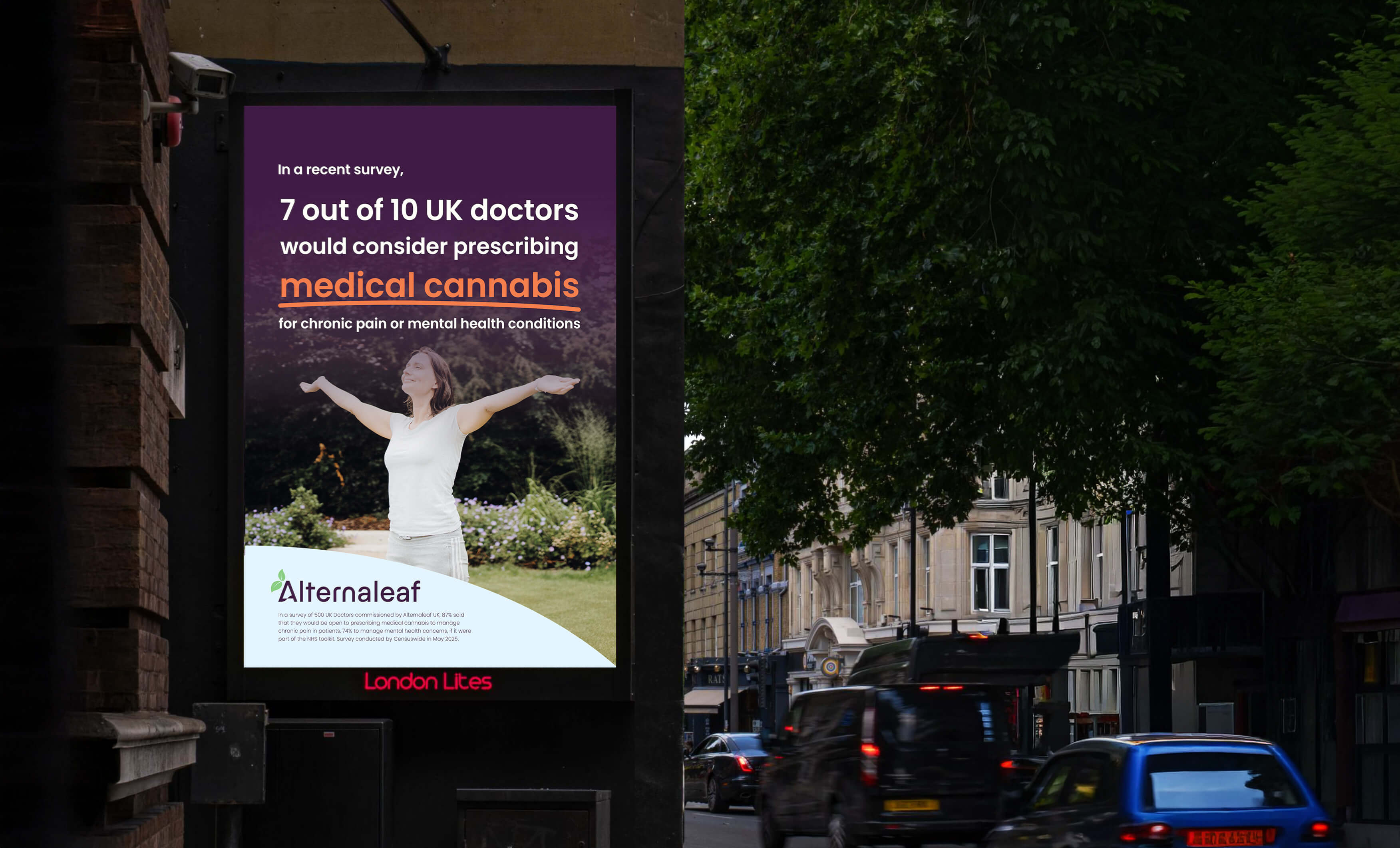 A brightly lit billboard displays an ad for "Alternaleaf," stating "7 out of 10 UK doctors would consider prescribing plant medicine for chronic pain or mental health conditions." A woman with outstretched arms is pictured surrounded by plants. The billboard is on a street with moving cars and buildings visible in the background.