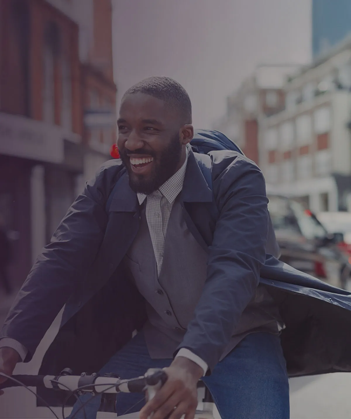 Man riding a bike with a smile 
