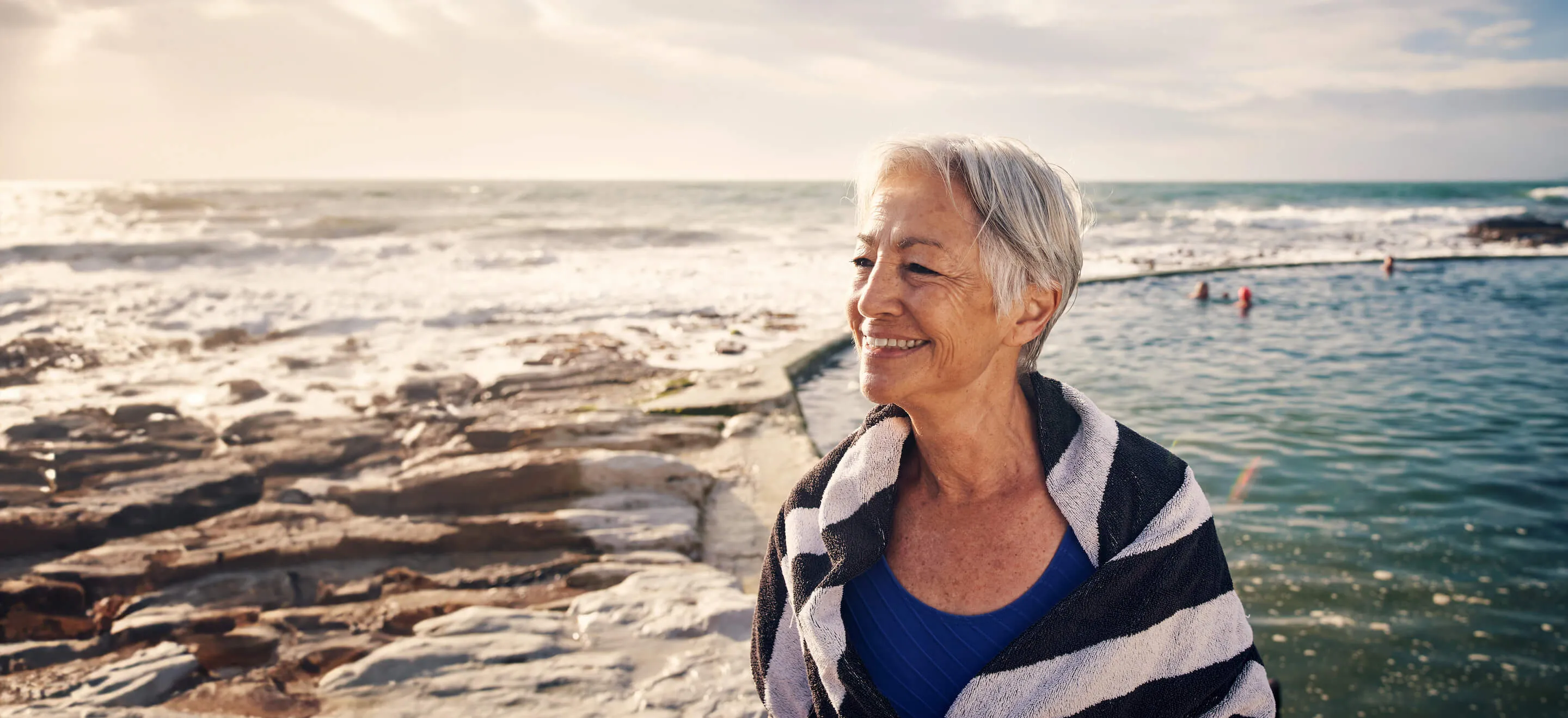 women smiling on the beach 