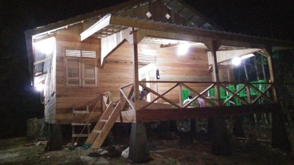 Carpenters work into the night to put final touches on Soraya Forest Research Station.