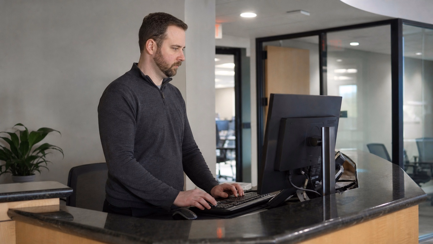 RECEPTION AREA An IT professional one person standing at a front reception d