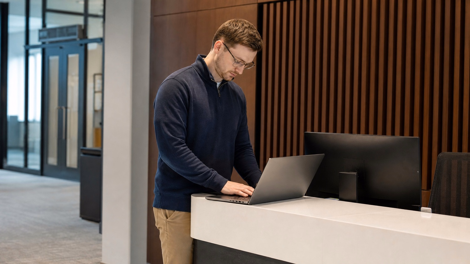 RECEPTION AREA An IT professional one person standing at a front reception d