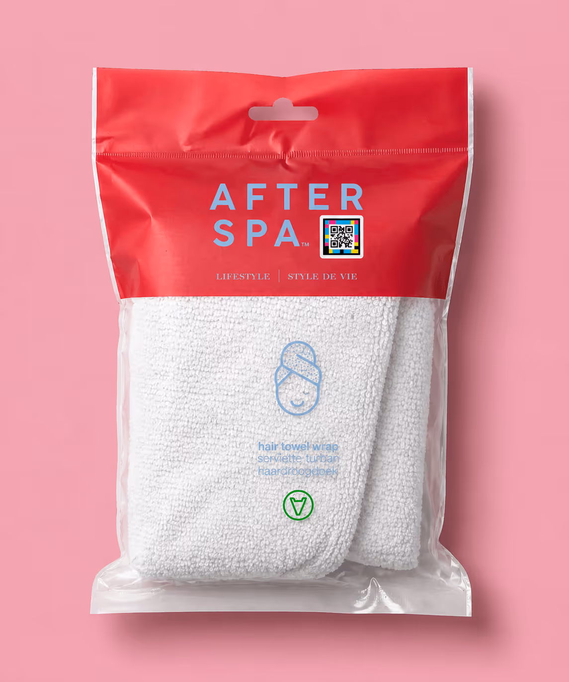 After Spa hair towel wrap in retail packaging on soft pink background.