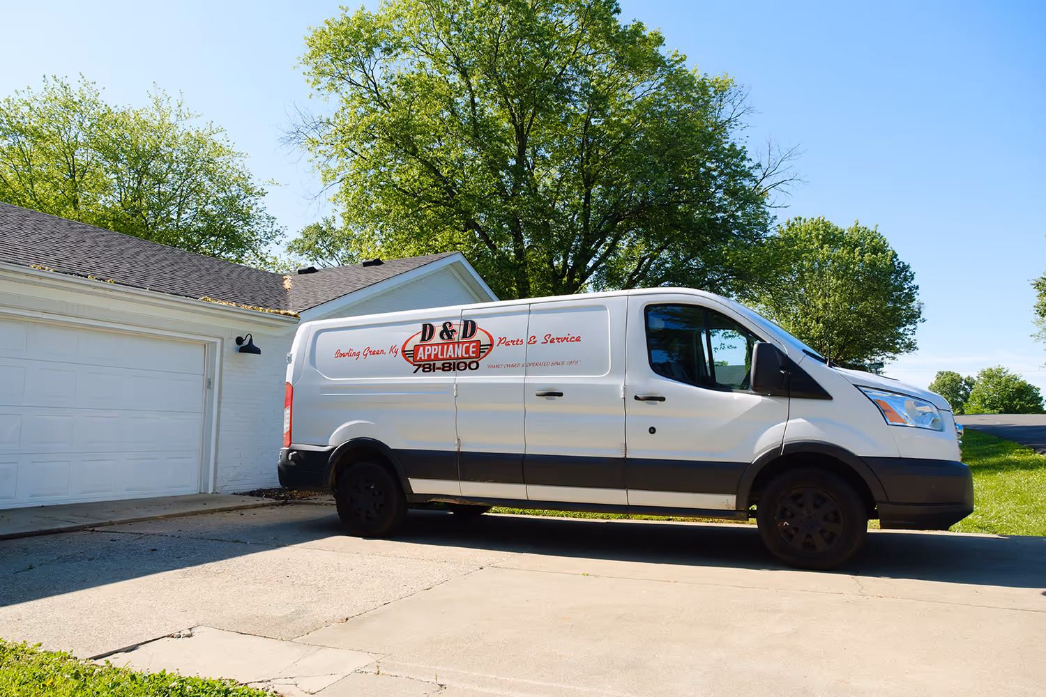 D&D Appliance Repair service van parked in a residential driveway in Bowling Green, KY