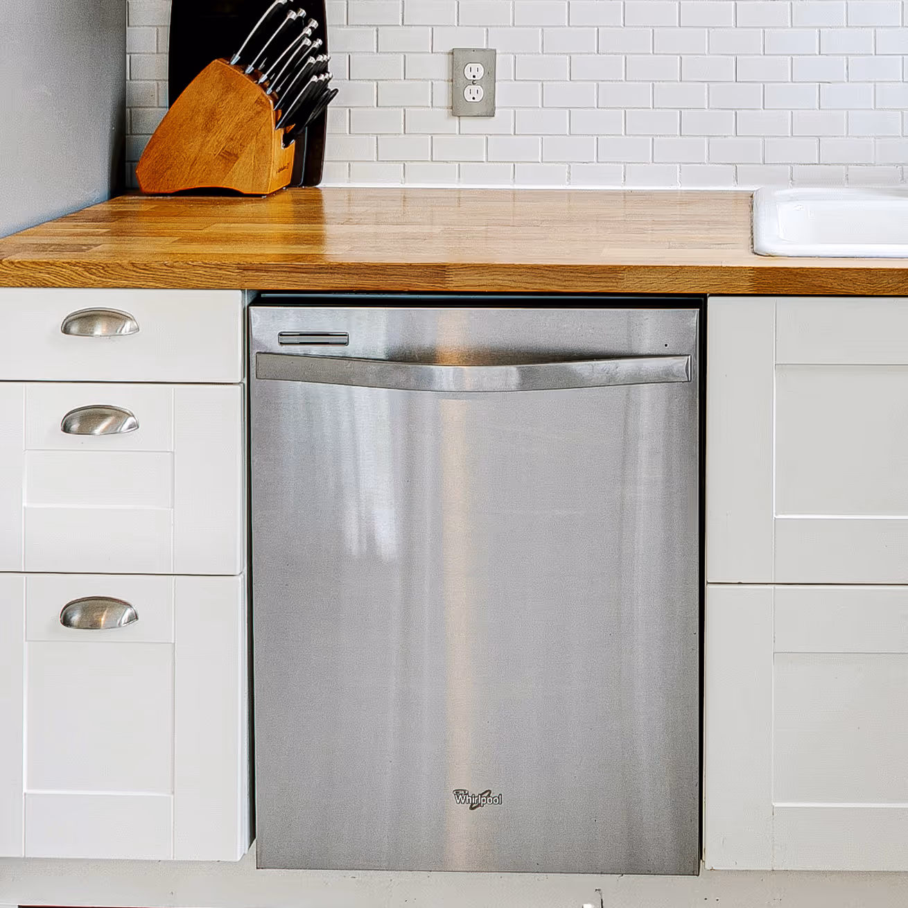 Modern built-in dishwasher with open door, representing D&D's dishwasher repair service