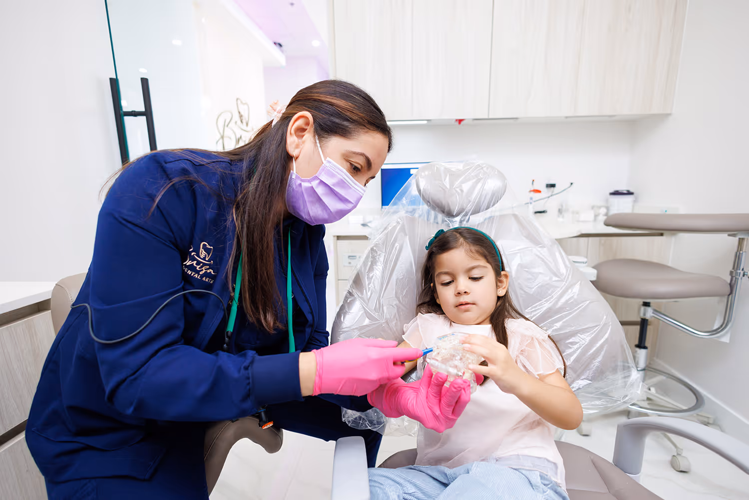 Dr. Cobo providing a family with dental care.
