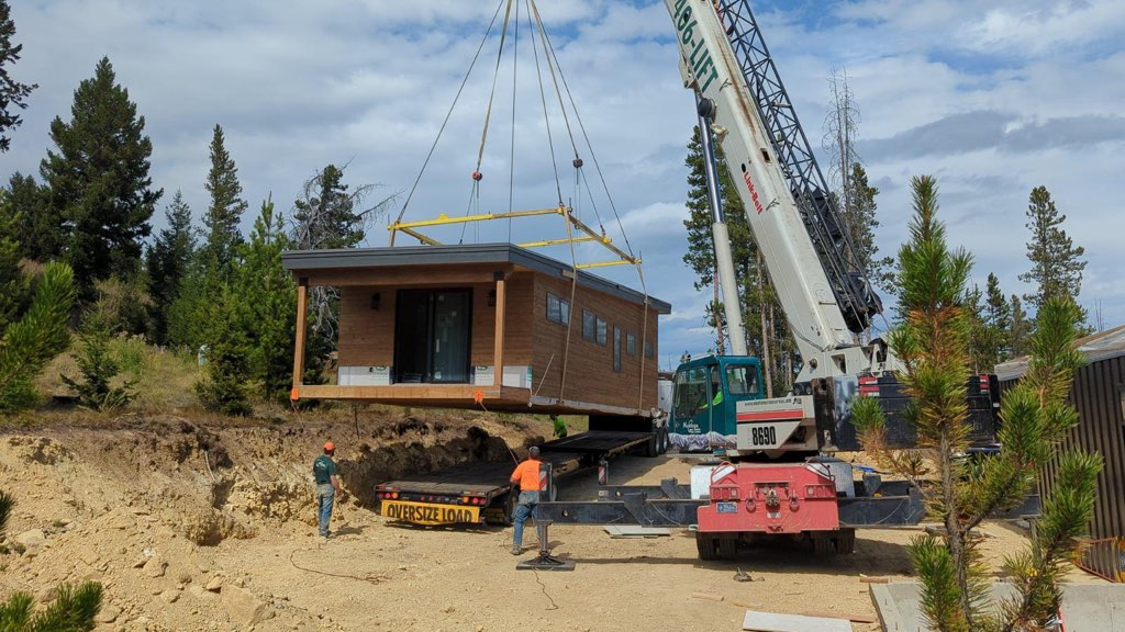 Crain setting modular home on foundation