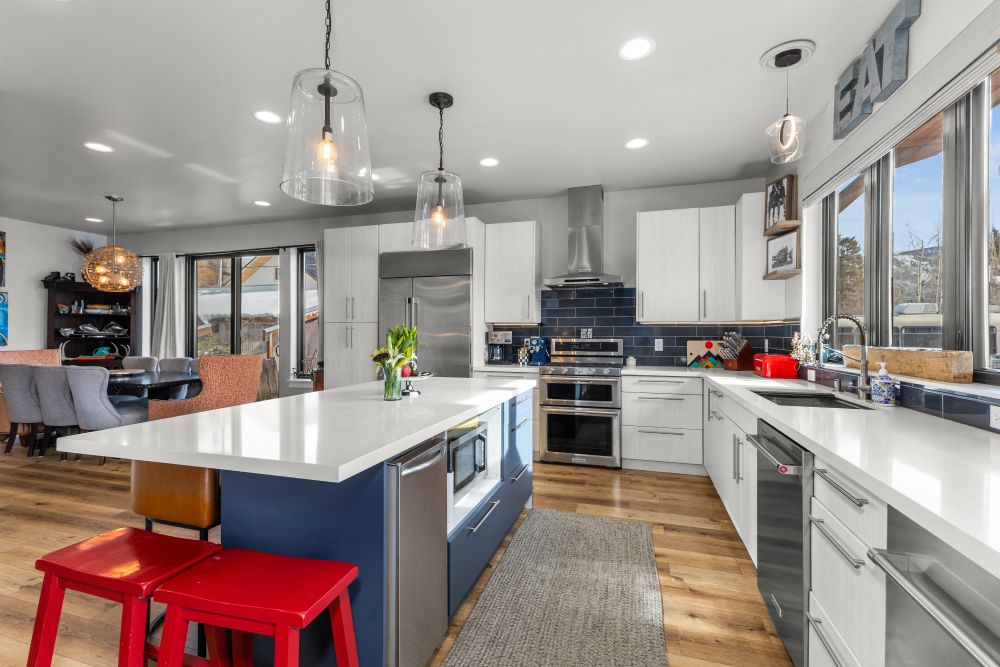 The kitchen and living room of a custom home in Steamboat Colorado built by SmartPads