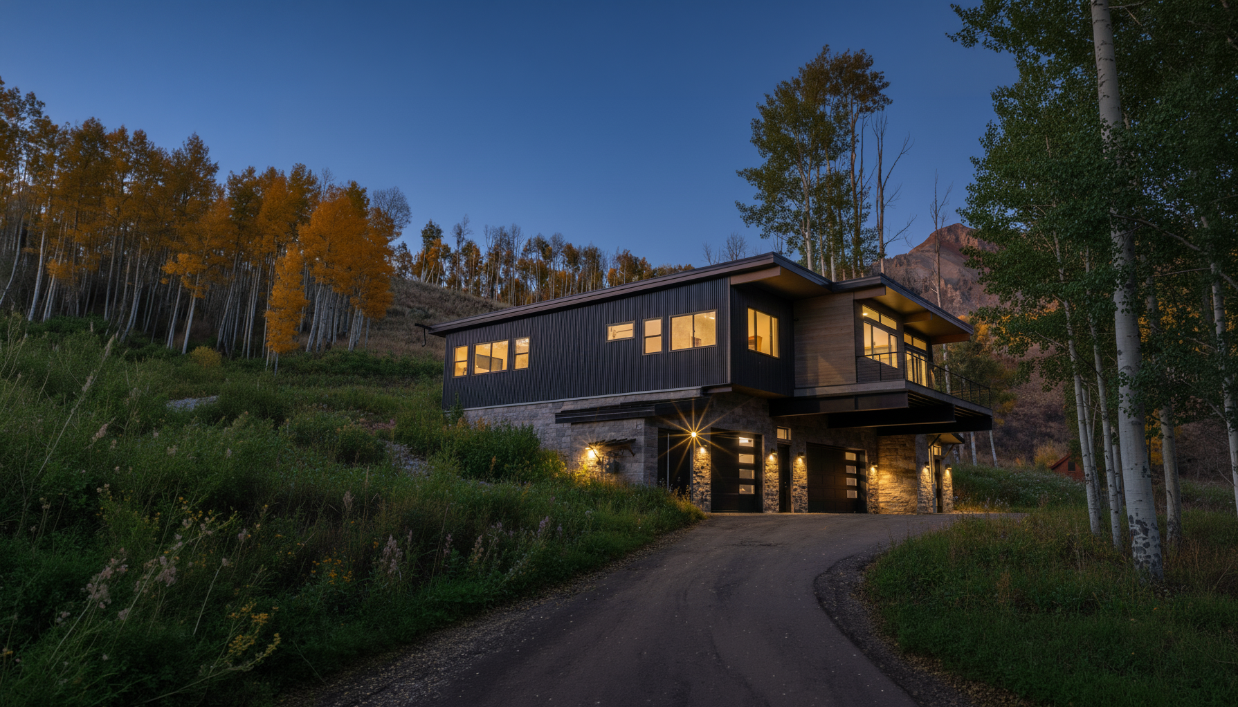 Modern Smartpads modular home in the Colorado mountains at dusk surrounded by golden aspen trees