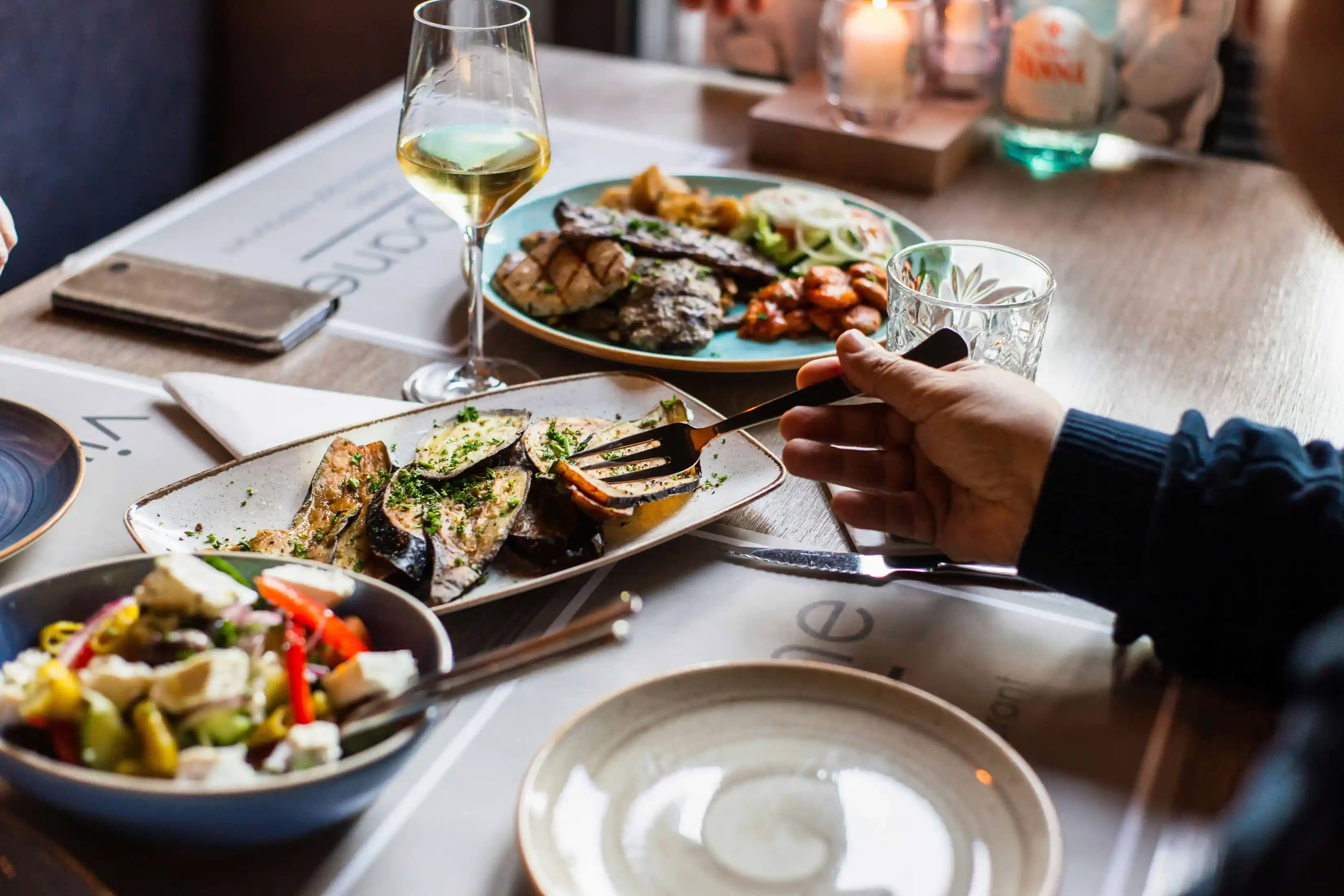 dinner plates set on table in restaurant