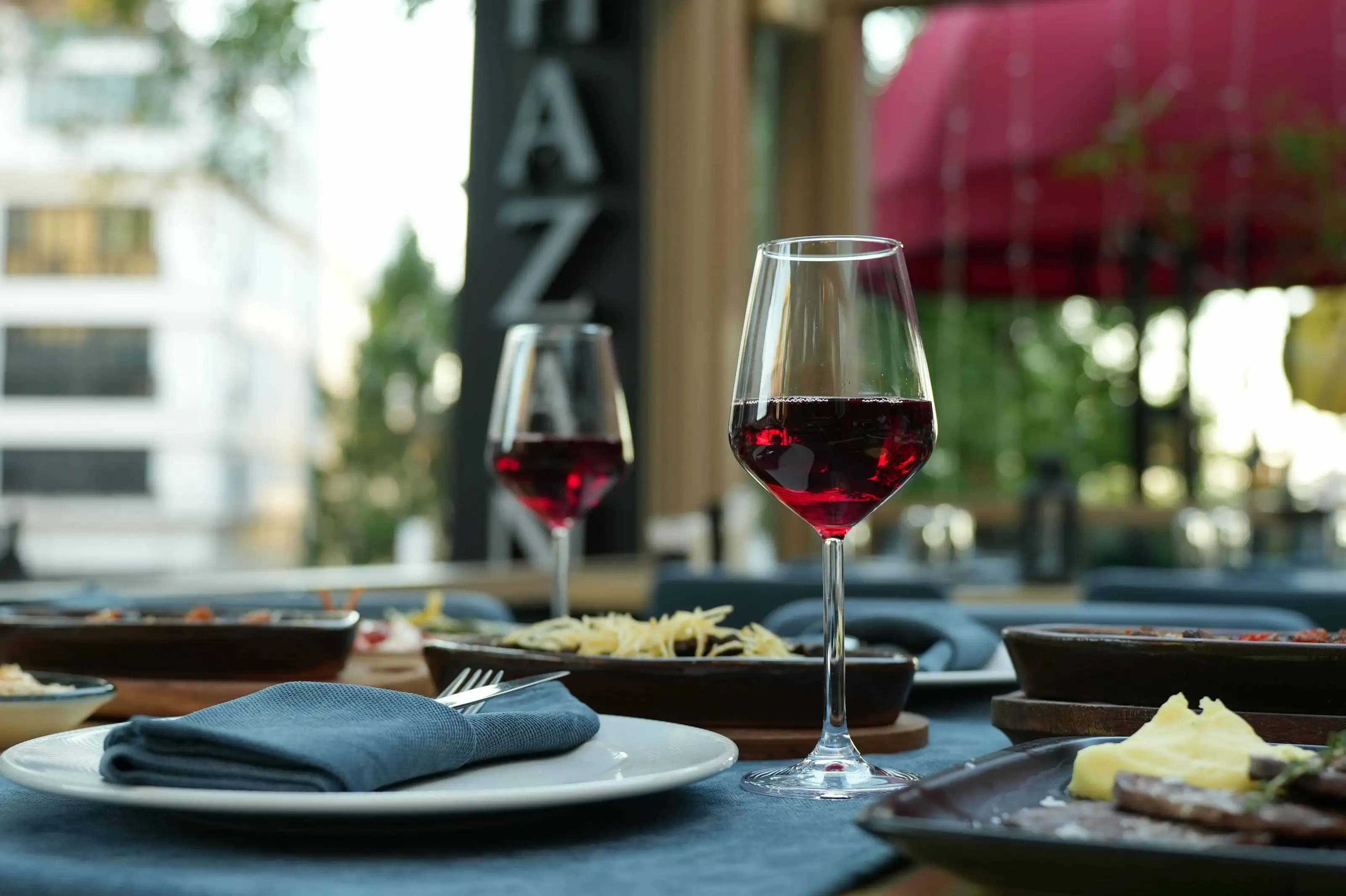 red wine full glasses on set table