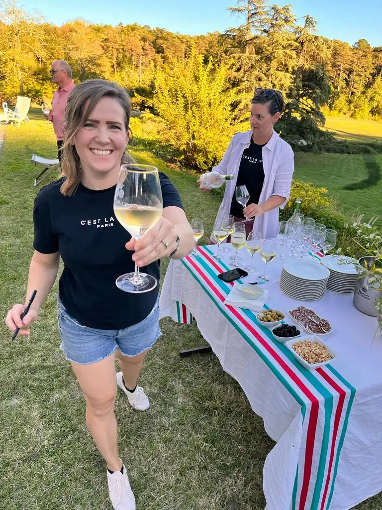 woman traveller toasting the camera in outdoor gathering