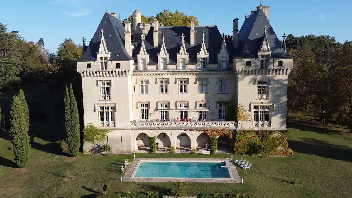 french castle in morning sunlight aerial view
