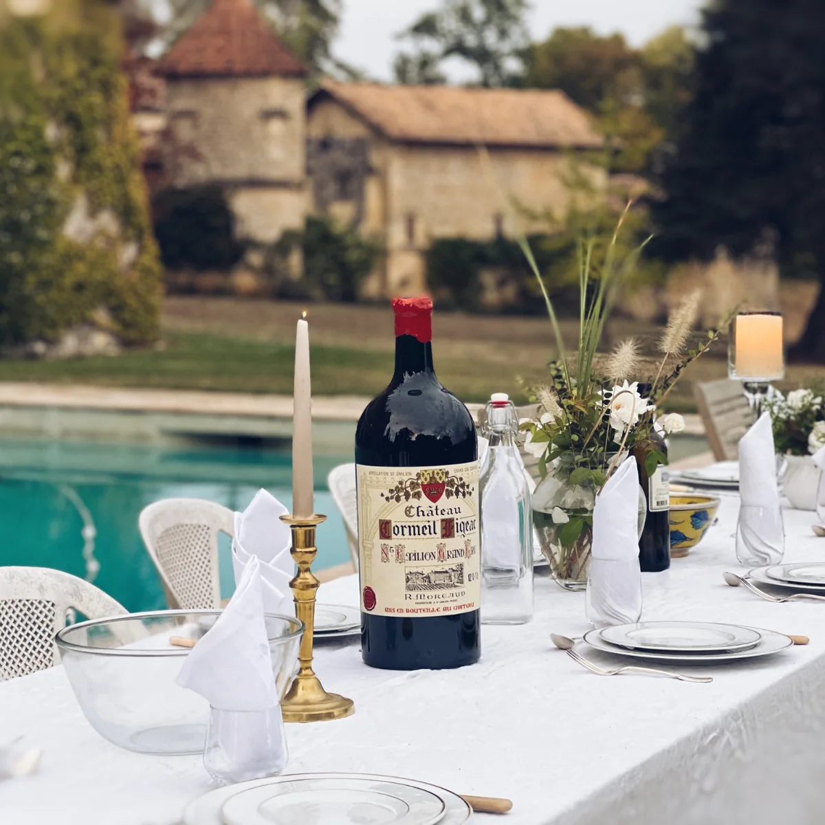 outdoor table setting by chateau pool