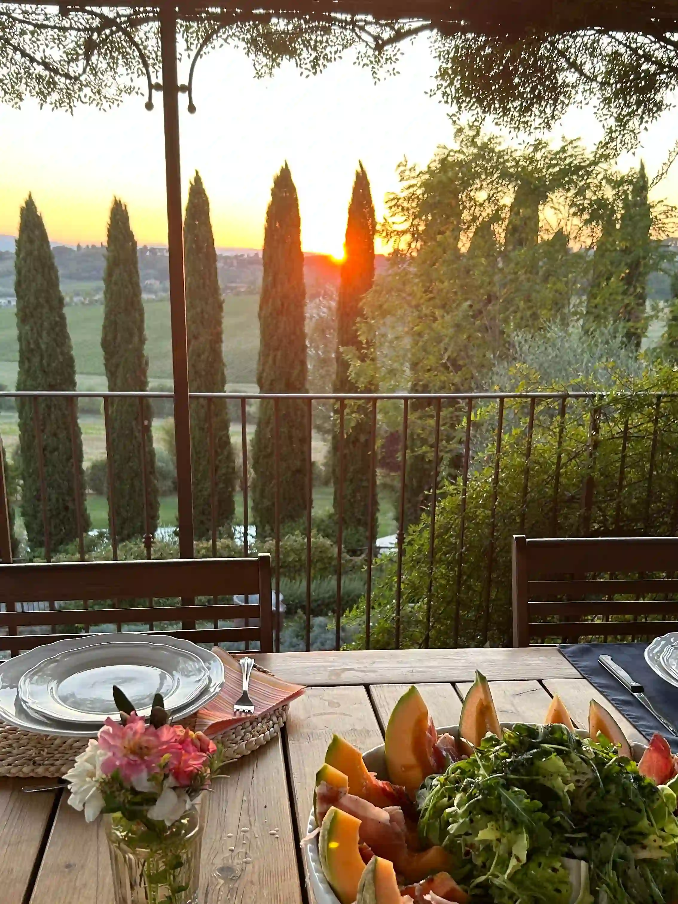 Tuscan sunset from outdoor patio with cantaloupe plate