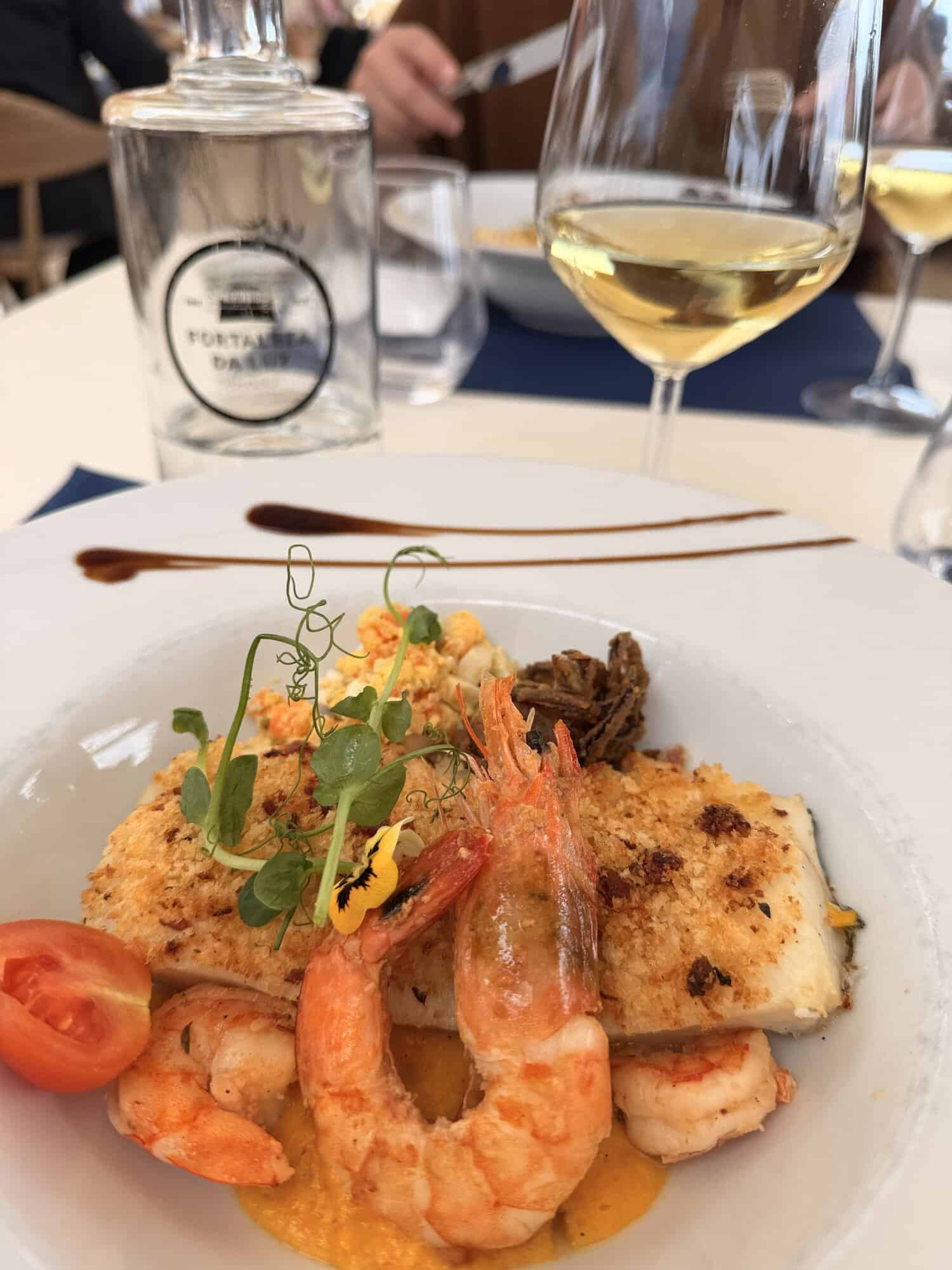 plates of food on outdoor dining table for two