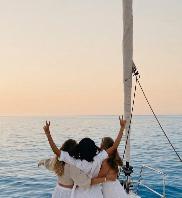 People enjoying a white party in a catamaran in Torrevieja.