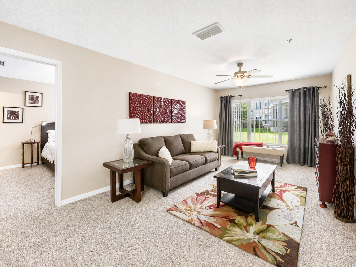 Living area with sofa, coffee table and lamp