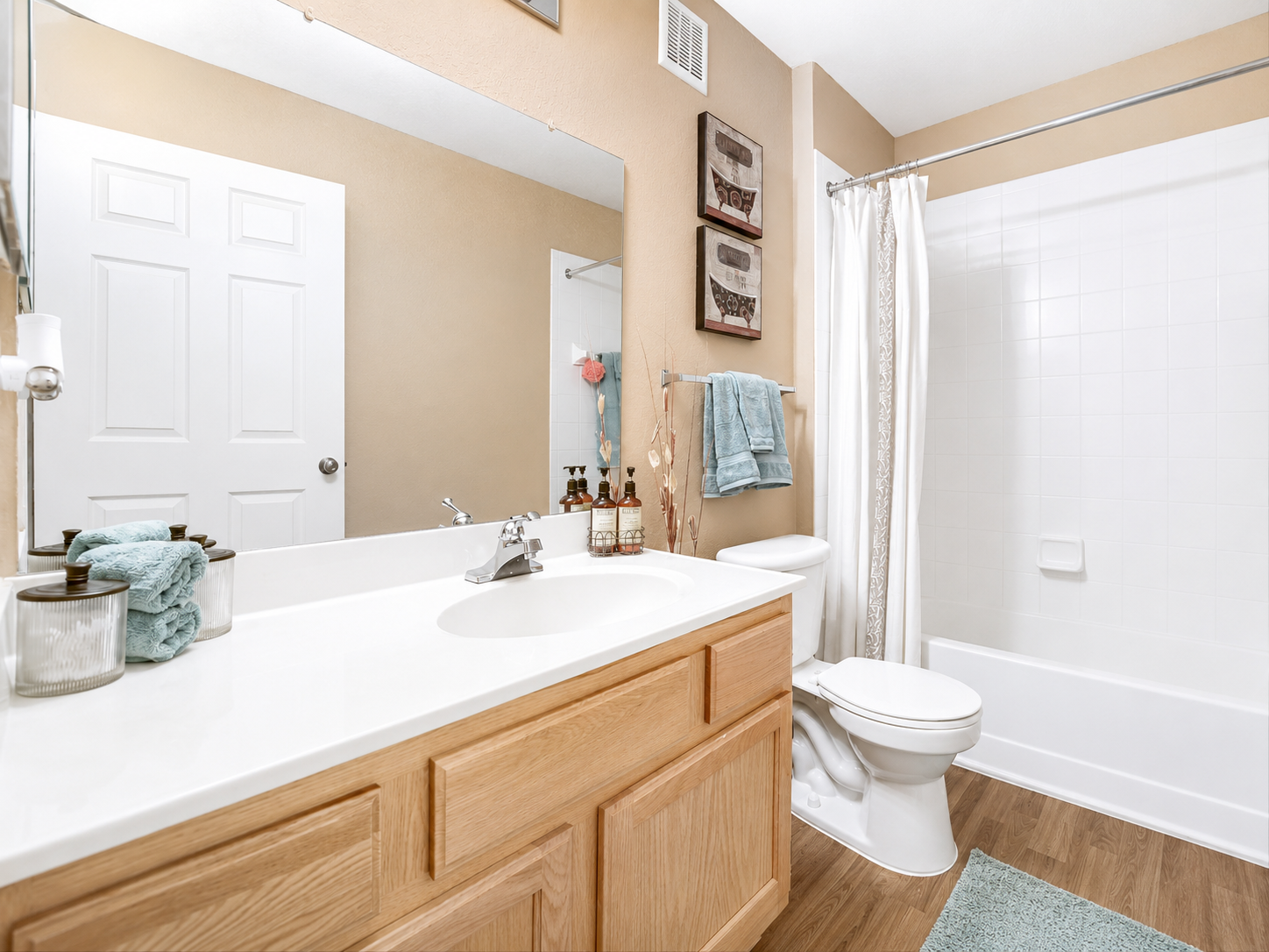Bathroom with vanity and shower tub combo