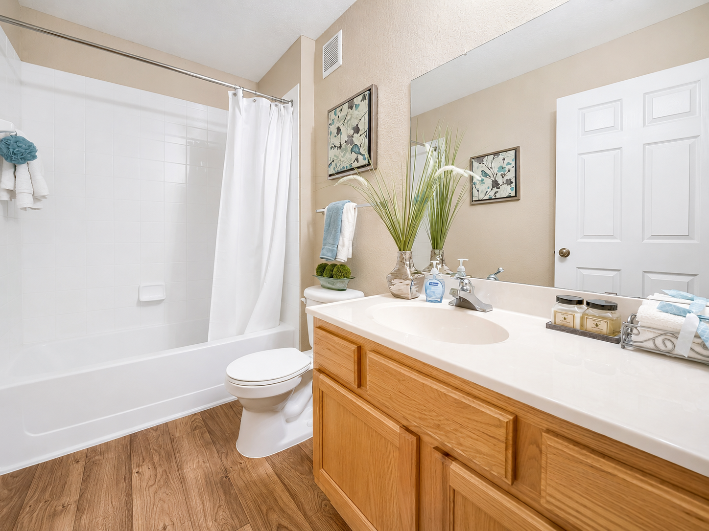 Bathroom with vanity and shower tub combo