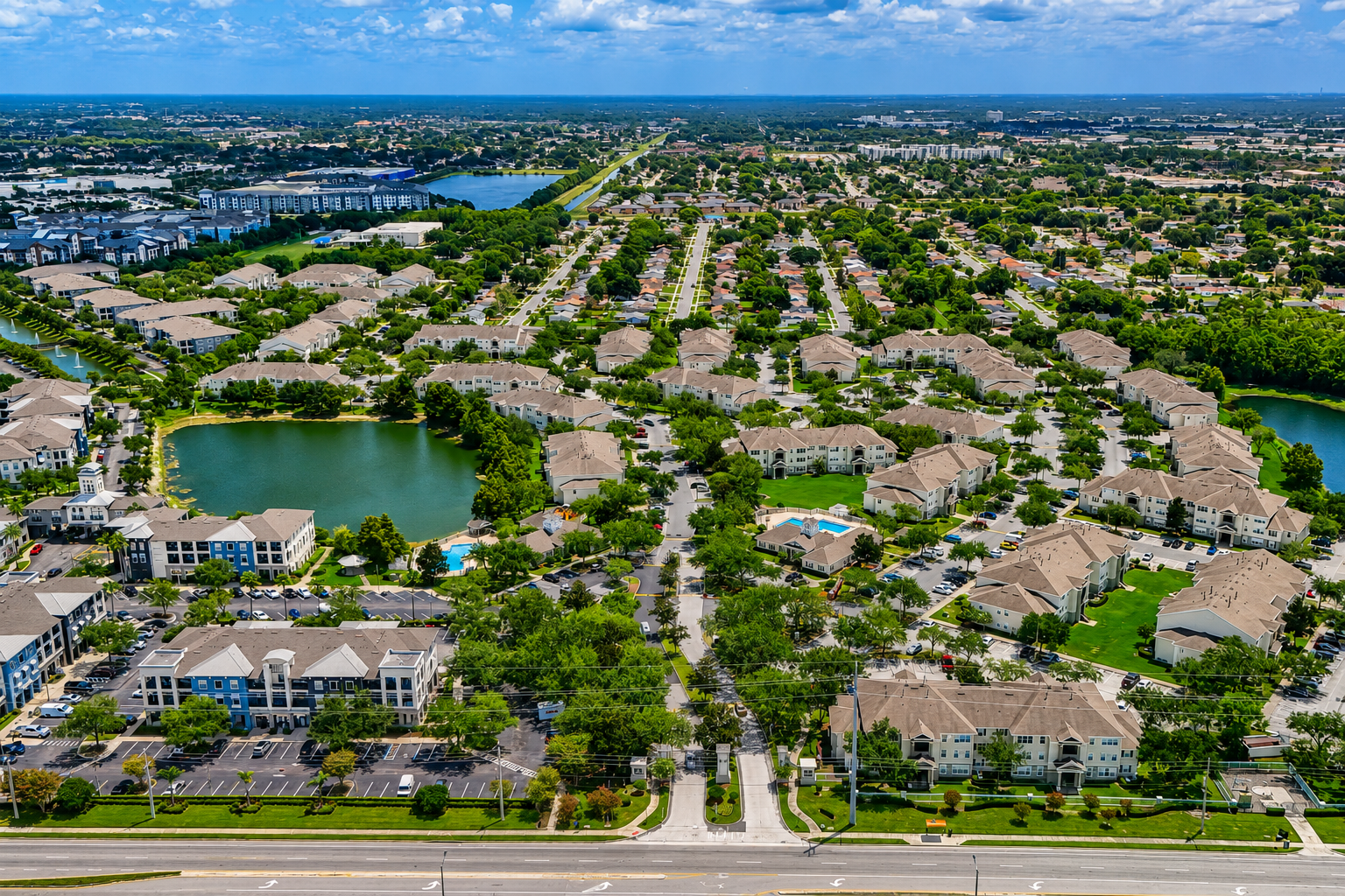 Aerial view of exterior and surrounding area with view of lakes
