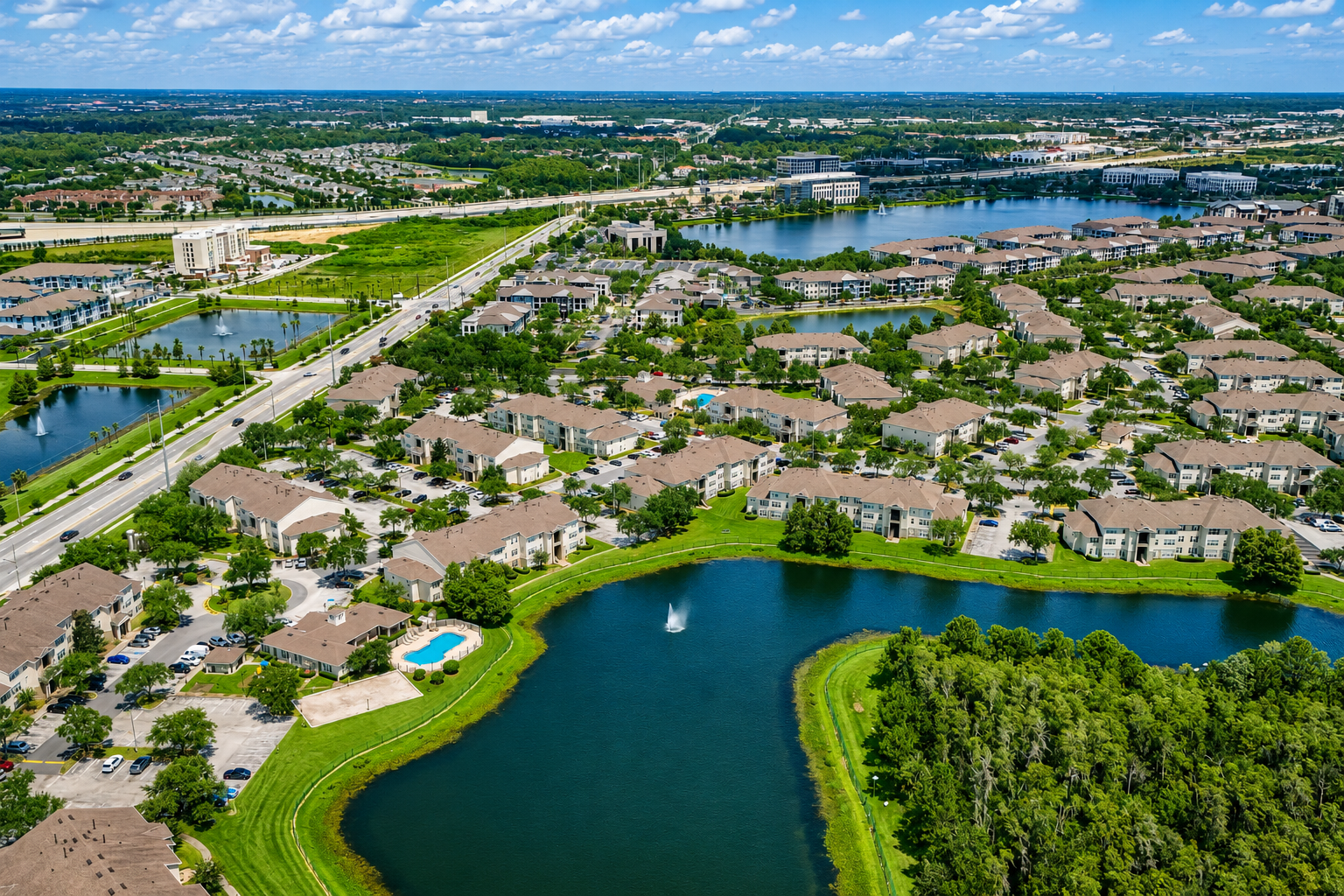 Aerial view of exterior and surrounding area with view of lakes