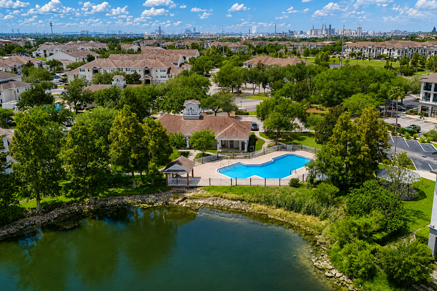 Aerial view of exterior and surrounding area with view of swimming pool