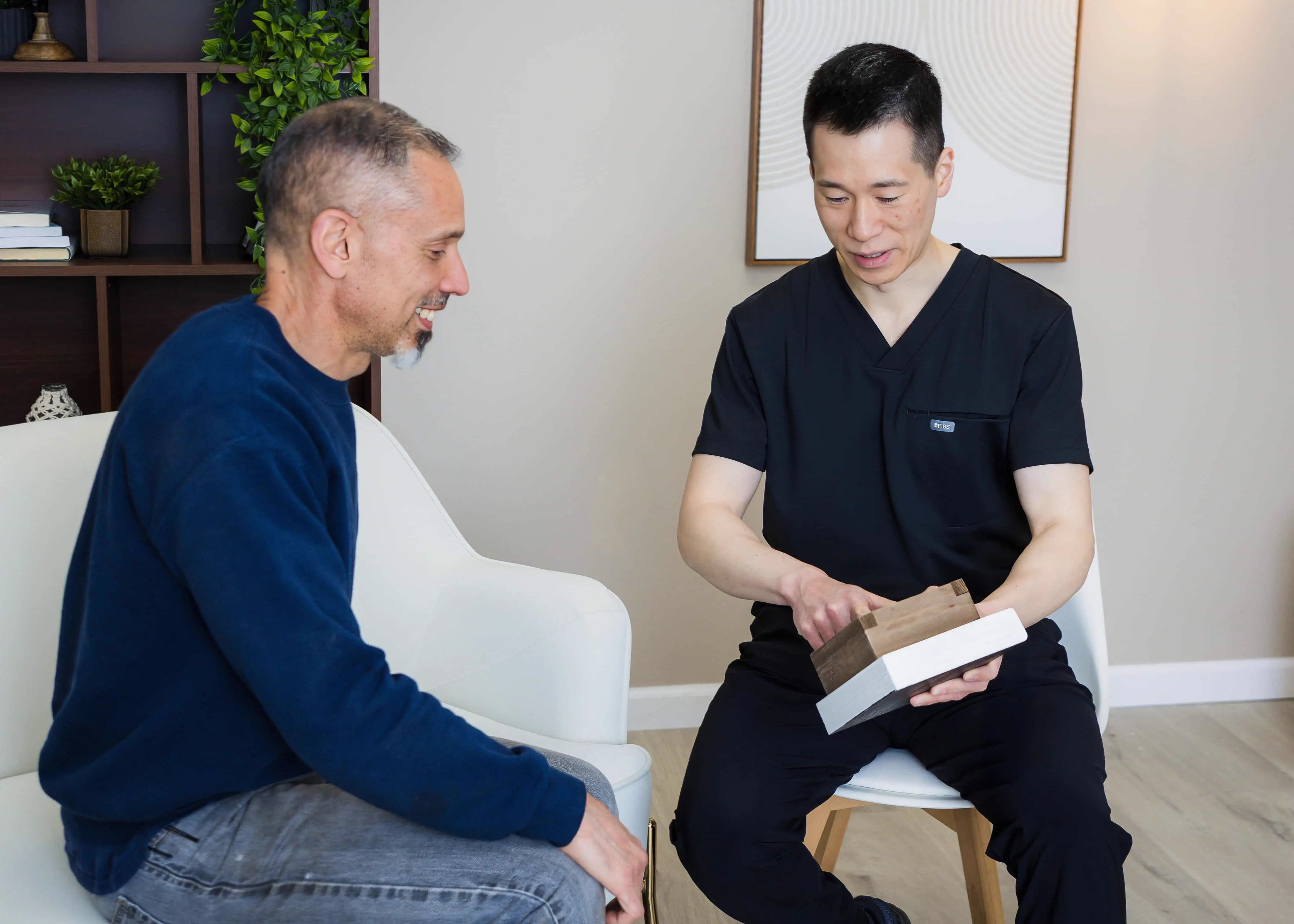 Dr. Chou providing personalized dental consultation to a patient at TrueSmile Health