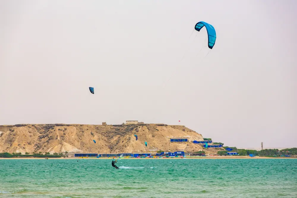 Multiple kitesurfers riding in strong afternoon trade winds at Dakhla