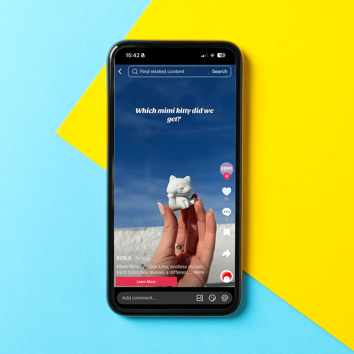 Smartphone displaying a TikTok video with a hand holding a small white cat figurine against a blue sky background, text reads 'Which mimi kitty did we get?'