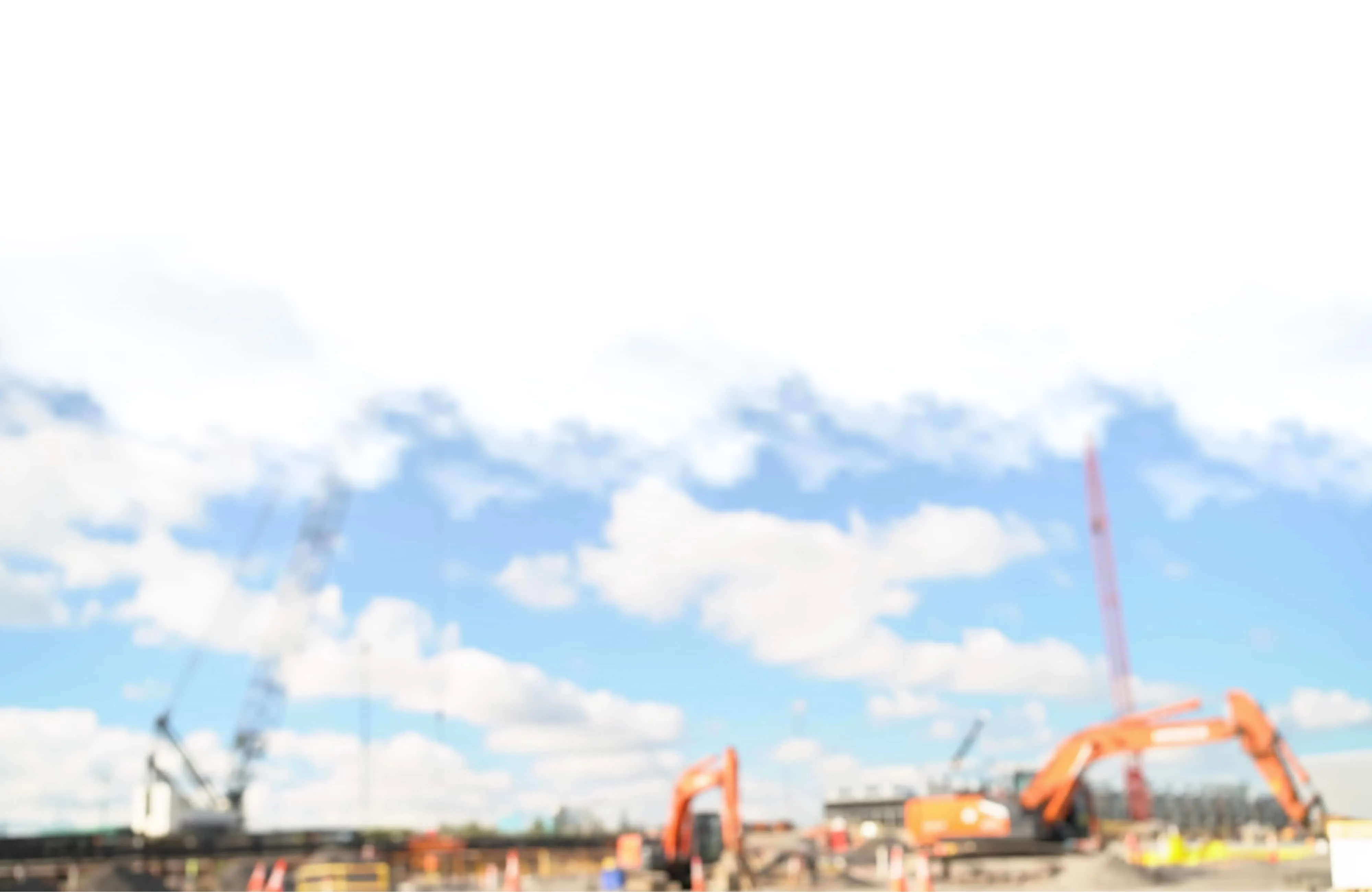 Blurred sky and construction cranes at a TeraWulf data center site, background image.