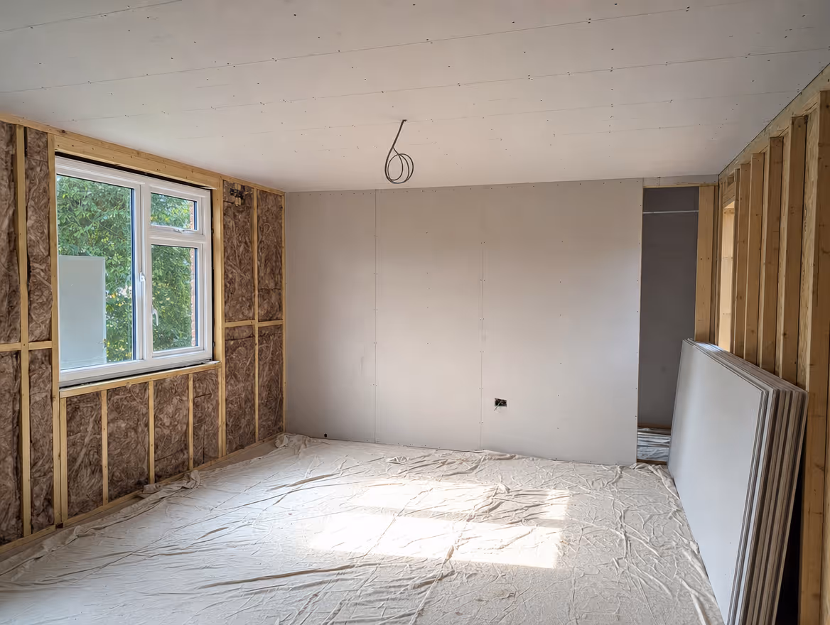 Garage conversion in progress with new blockwork and window opening