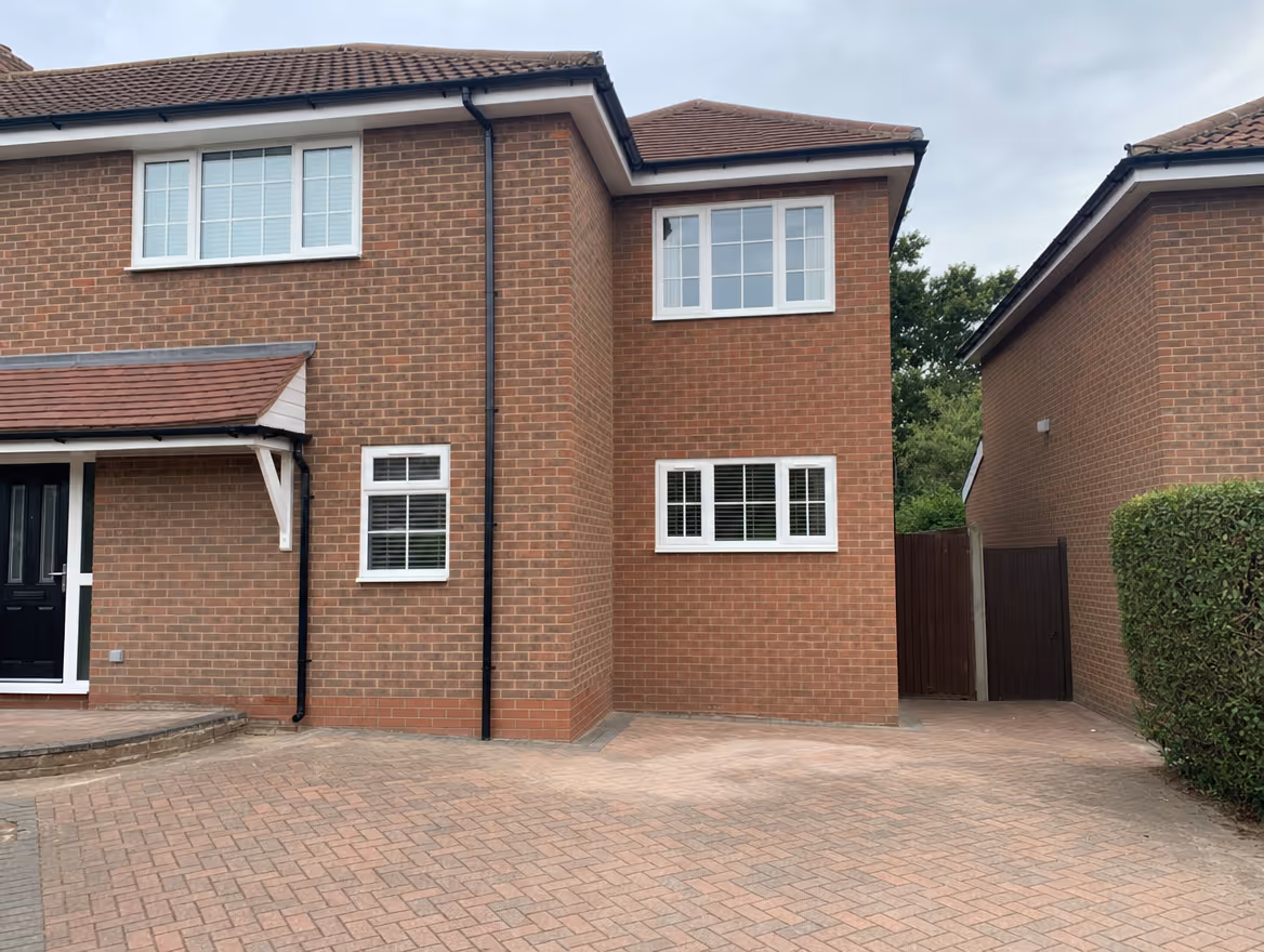 Two-storey side extension in matching brick