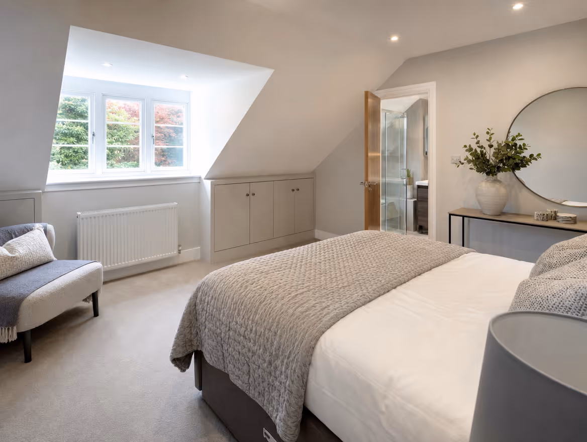Loft conversion bedroom with dormer window and eaves storage
