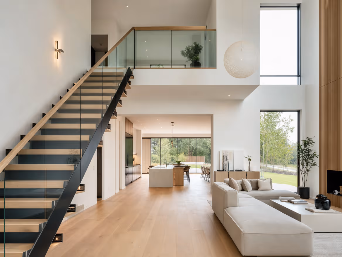 New build open-plan living with feature oak and glass staircase