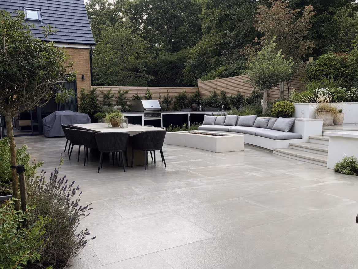 Large porcelain patio with outdoor dining and kitchen area