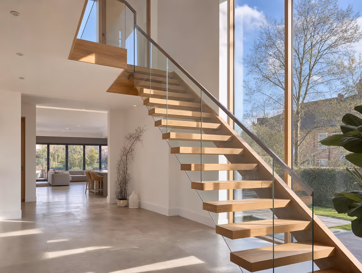Feature oak and glass staircase with floating treads