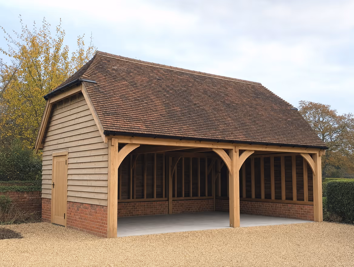 Detached oak-frame double garage with brick plinth and clay tiled roof