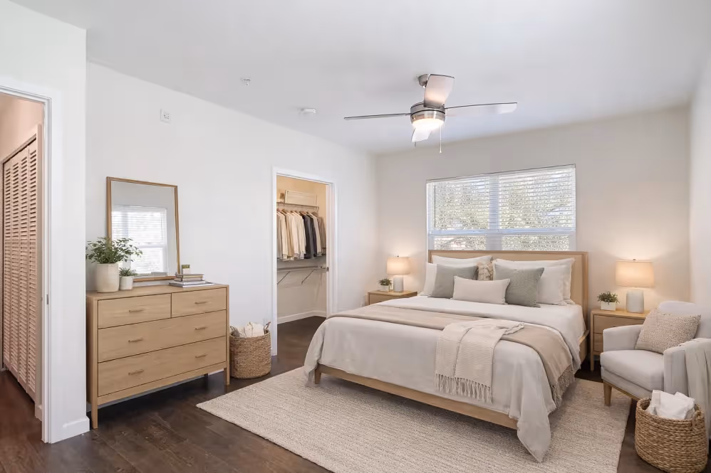 Bedroom with bed and furniture and view of closet