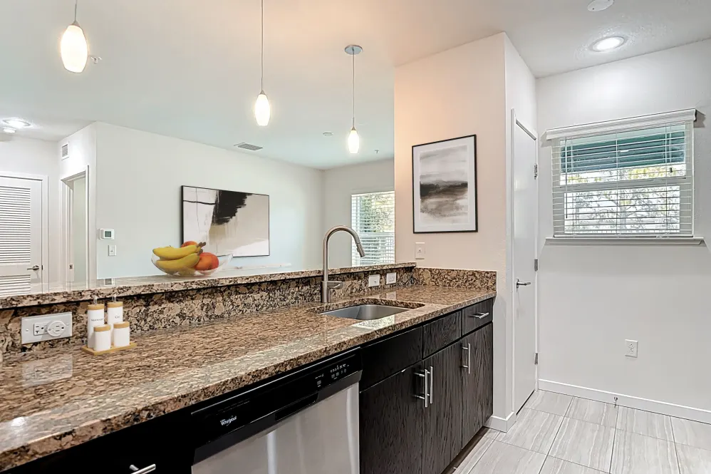 Kitchen island with brown cabinets and breakfast bar