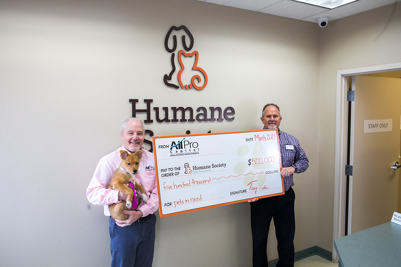 Tony Bettis presenting a check to the Humane Society