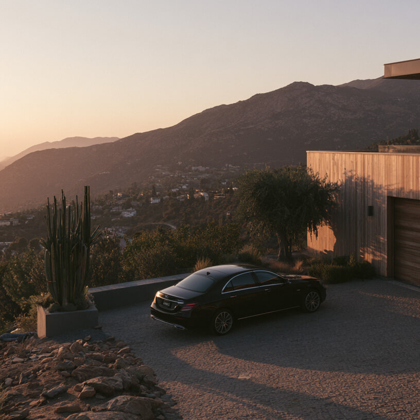 Mercedes car in a nice Southern California driveway at sunset.