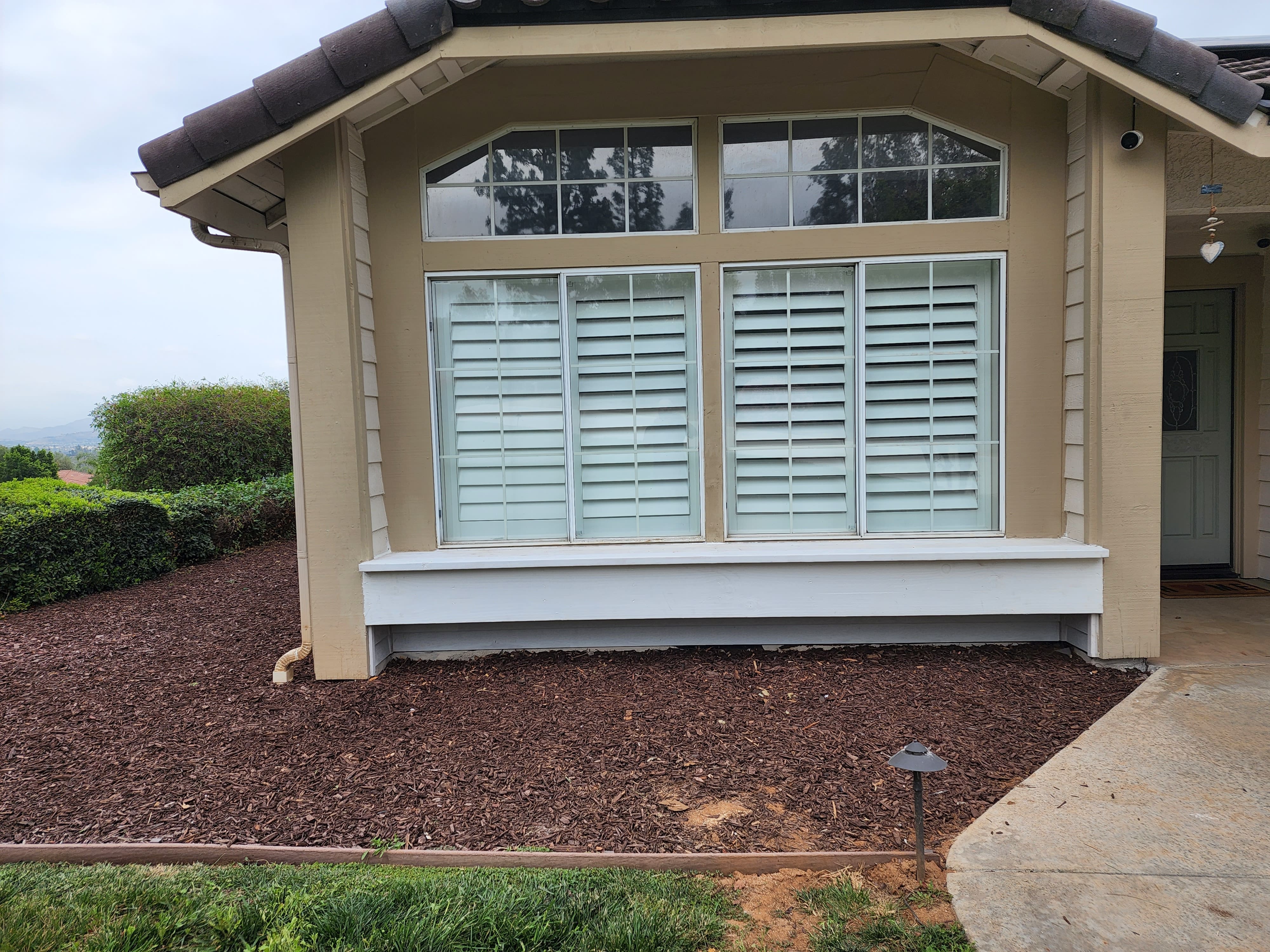 Restored exterior wall and trim after Pro Kill repair