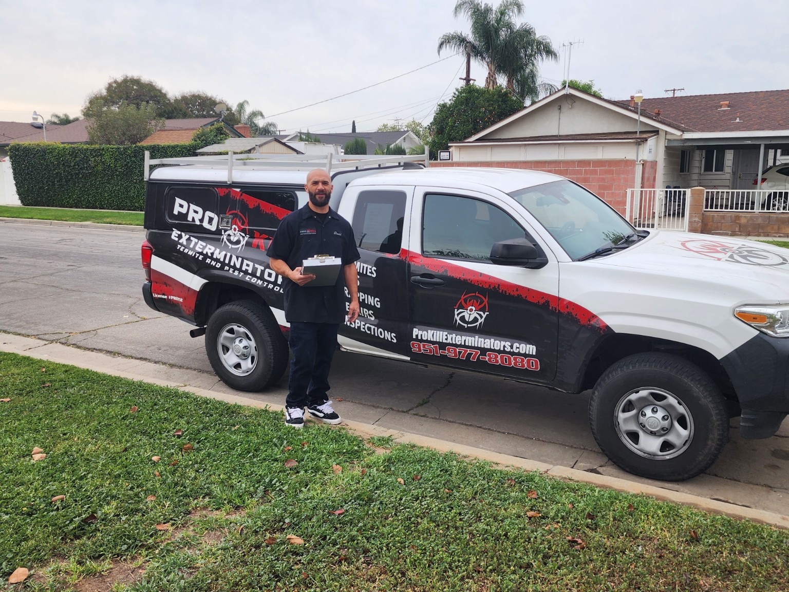 Pro Kill inspector with branded service truck after a Riverside property inspection