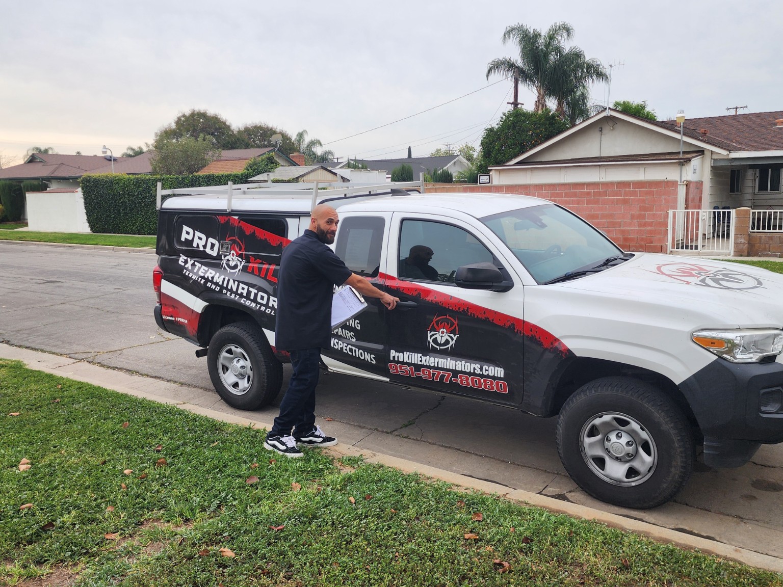 Pro Kill Exterminators technician and service truck serving Corona, California