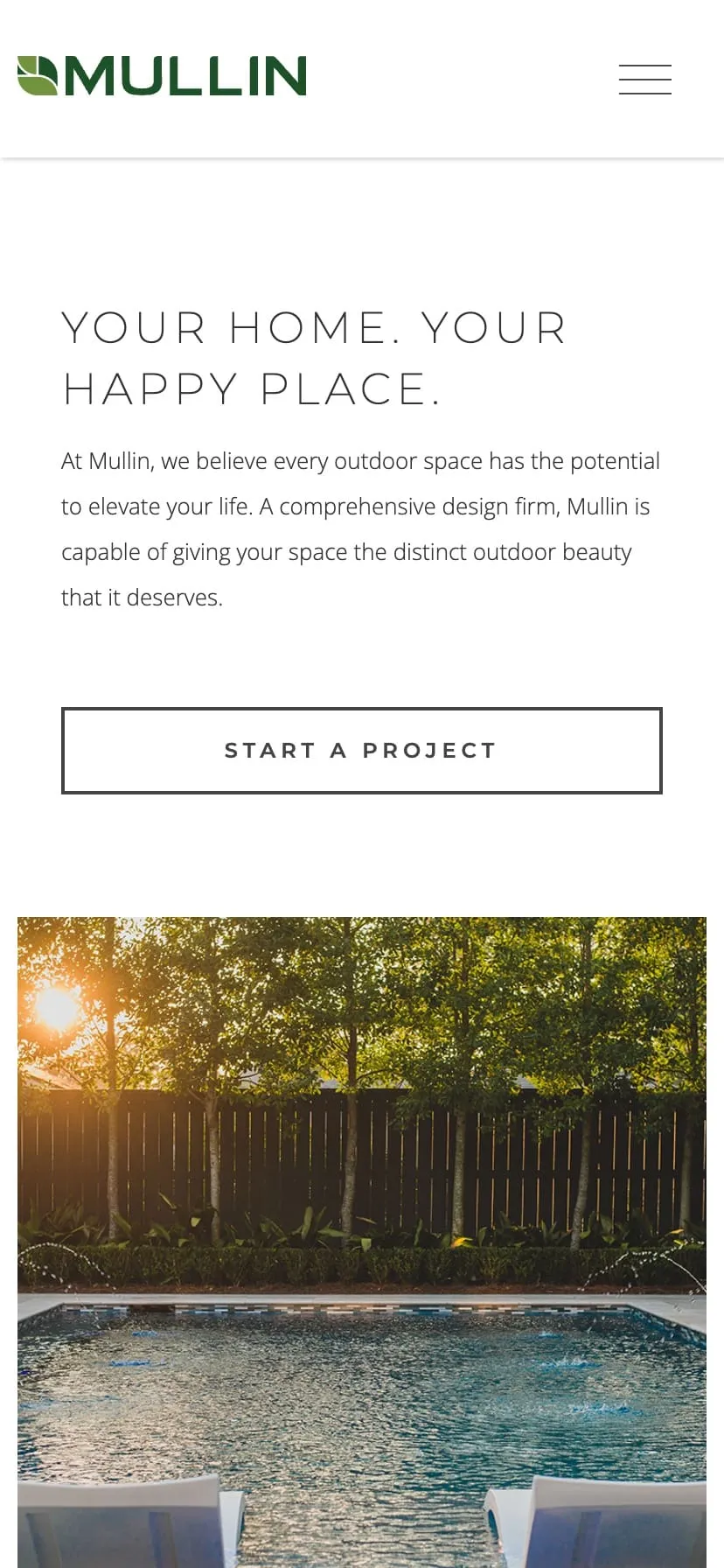 A phone showing the Mullin residential page headlined Your Home. Your Happy Place.