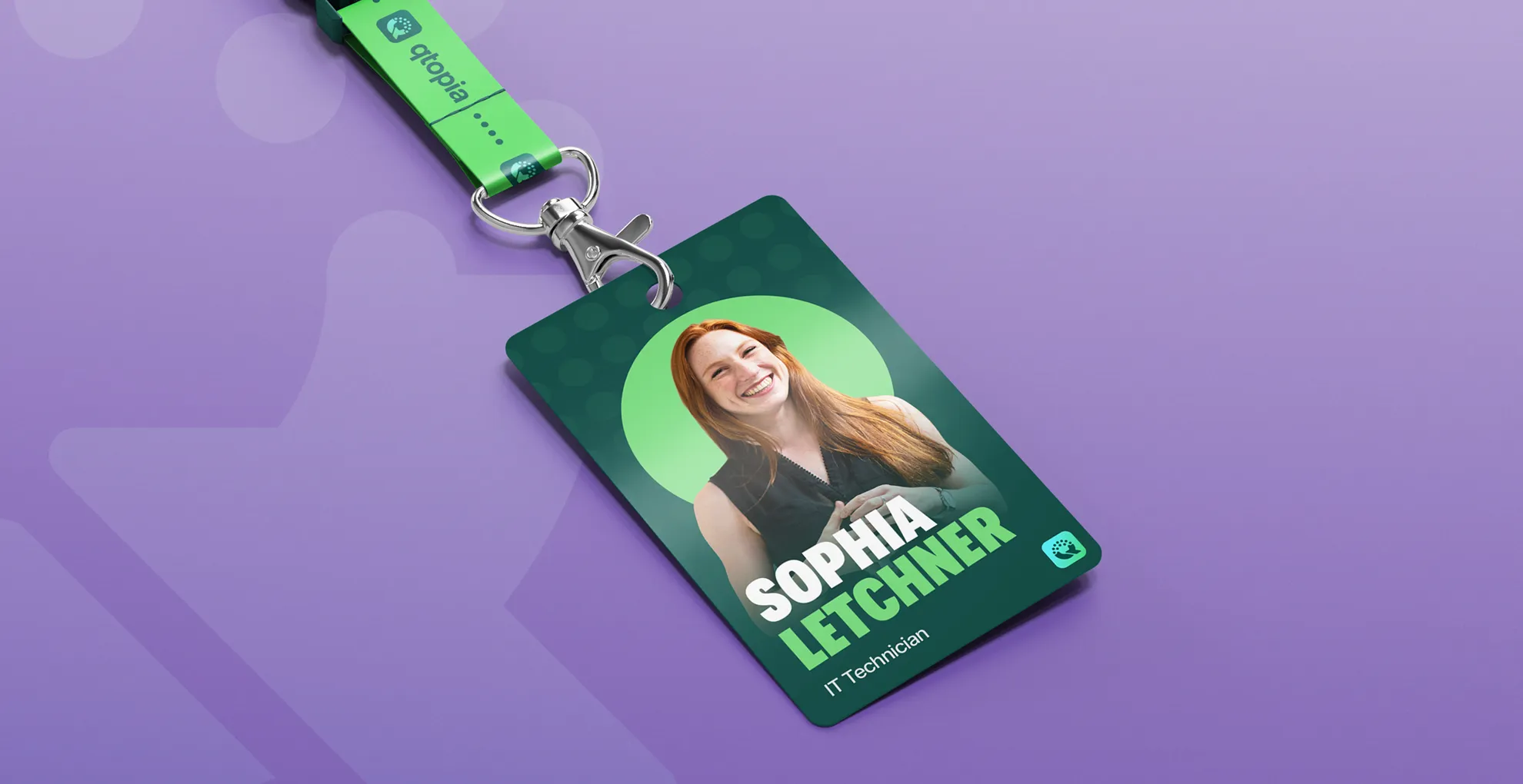 A Qtopia branded lanyard badge on a purple background
